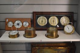 Four brass cased vintage bulk head barometers and two further ship's barometers
