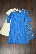 Three 1950s and 1960s dresses, all having oriental influence, medium sizes.