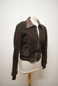 A 1960s/70s unisex suede jacket, having fitted waist and leather collar.