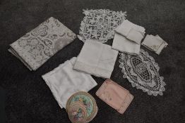 An assortment of vintage and antique table linen.