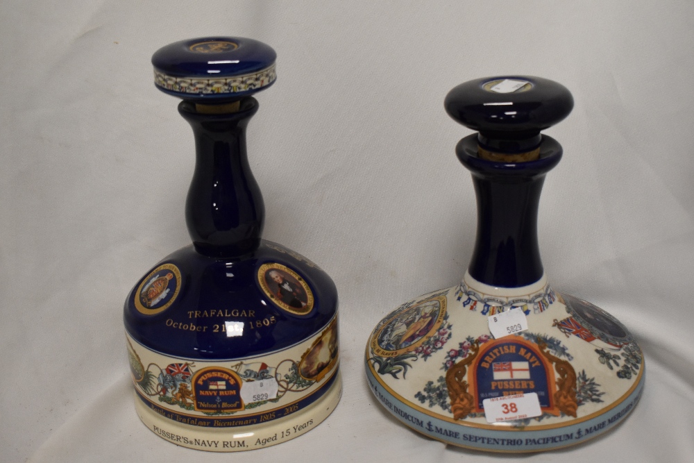 Two Wade porcelain ceramic spirit decanters, comprising a British Navy...