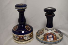 Two Wade porcelain ceramic spirit decanters, comprising a British Navy Pusser's Rum ship's