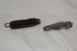 Two World War 2 military folding knives with J.Rodgers & Sons steel blades
