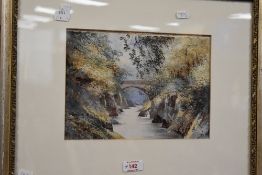A late 19th/early 20th century British School watercolour, autumnal gorge with bridge, unsigned,