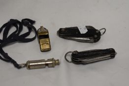 Two 1940s military jack knifes and two whistles, 'The Acme Thunderer' and 'The Acme City'