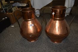 Two 19th Century planished copper and twin handled urns with decorative gilt banding, measuring 34cm
