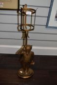 A gilt painted metal table lamp, modelled as Mr Pickwick, 'Made In England', Rd. 798010, measuring