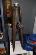 Two vintage surveyor's tripods, the largest measures 95cm tall