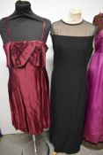 A 1960s cerise maxi dress with sequin detailing, a black 1960s maxi dress with rhinestones to