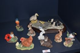 An assorted group of Border Society and other animal ornaments, to include a border collie and goose