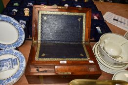 A Victorian mahogany writing slope, with brass metal decoration and banding, the interior having a