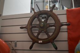 An antique six pointed oak motor launch ship's wheel, metal bound, 56cm diameter
