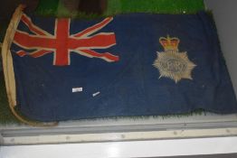 A vintage Piggott Brothers Metropolitan Police flag, 40cm x 80cm, together with two larger flags,