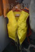 A group of four life jackets, by Jack Holt, and other manufacturers