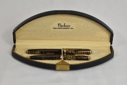 A boxed Parker Vacumatic Debutante fountain pen and propelling pencil in gold pearl. In near mint