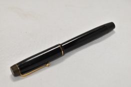A button fill Valentine fountain pen in black with single narrow band to the cap