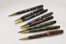 Eight Burnham propelling pencils
