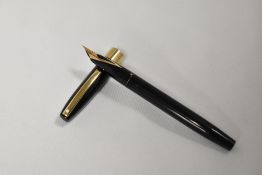 A Sheaffer Imperial Lifetime plunger fill fountain pen in black with broad band to base of cap. In