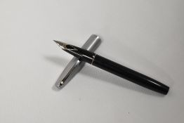 A Sheaffer 440 converter fill in black with brushed steel cap. In fair condition needs new