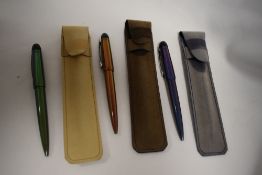 Three Waterman Kultur Iridescent ballpoint pens in soft wallets in green, brown and blue in as new
