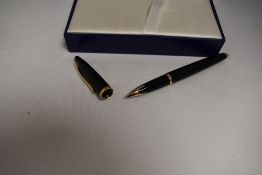 A boxed Waterman Carene cartridge/converter fountain pen in black with gold trim having Waterman 18k