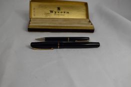 A boxed Wyvern Perfect lever fill fountain pen and propelling pencil set in black with single