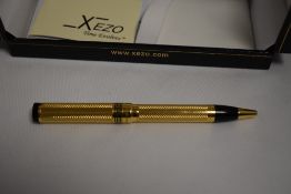 A boxed Xezo Tribute Unite 4 Good limited edition 204/500 ballpoint pen. 18k gold plating with black