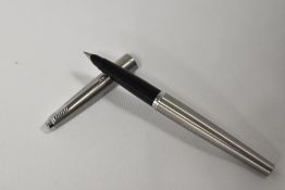 A boxed Parker 45 Flighter fountain pen in brushed steel. In good condition
