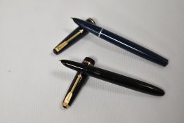 Two Parker fountain pens. A Parker17 lady in blue and a Parker Duofold lady in black. Both in good