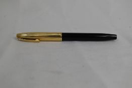 A Sheaffer Imperial cartridge/converter fountain pen in black having gold filled cap and white