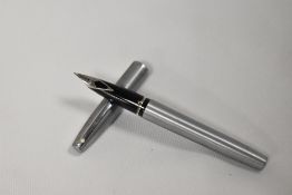 A Sheaffer 440 cartridge/converter fill in brushed steel. In fair condition