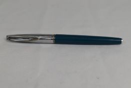 A Waterman CF cartridge fountain pen in blue and cream with metal cap having 14ct nib. Good