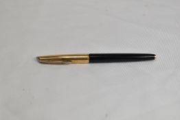 A Waterman CF converter fountain pen in black with a gold cap having 14ct nib. In good condition