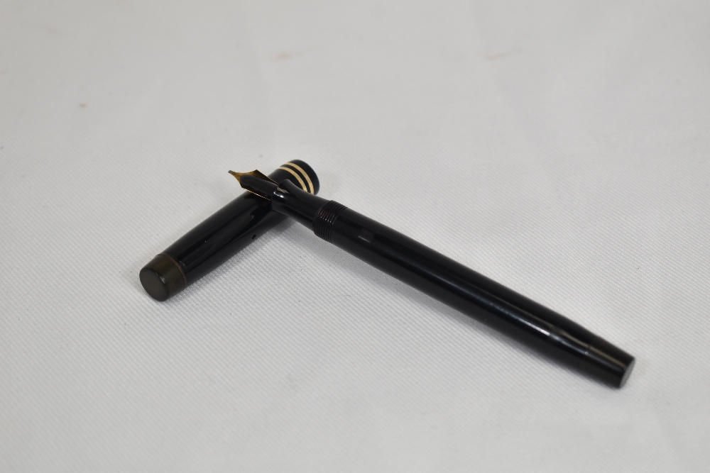 A Parker Duofold Streamlined button fill fountain pen in black with two bands to the cap and - Image 2 of 3