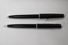 A Boxed Parker 45 ballpoint pen and propelling pencil set in black. Good condition