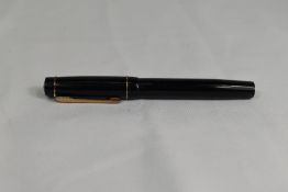 A Croxley 'The Croxley Pen' lever fill fountain pen in black with single band to cap having