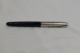 A Parker 51 vacu fill fountain pen in black with lustiloy cap. Approx 13.8cm in very good condition
