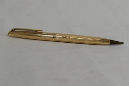 A Waterman rolled gold propelling pencil (engraved)