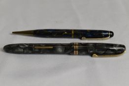 A Burnham B59 lever fill fountain pen in grey marble with three narrow bands to the cap having