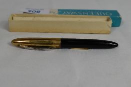 A boxed Queensway Dainty lever fill fountain pen in black with gold plated cap having Queensway 18ct