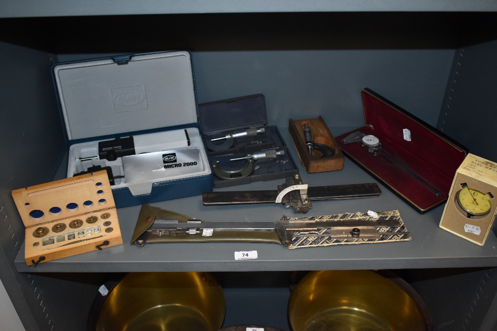 A collection of measuring devices including micrometers and vernier gauges and similar.