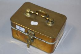 An antique brass spice tin with handle and internal compartments.