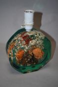 A vintage resin lamp having crabs, starfish and shells inset.