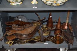 A collection of vintage and antique items, including bellows, copper measures, flat iron and