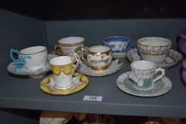 A mixed lot of 19th and 20th century cups and saucers, including Coalport cabinet cup and saucer