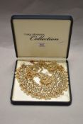 A vintage Tara Vanessa Collection jewellery box set comprising earrings, necklace, and bracelet of