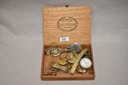 A vintage wooden box containing wrist and pocket watches, to include a half hunter Quartz pocket