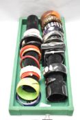A collection of bangles, mixed styles and eras, including early plastic examples.