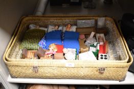 An assorted collection of mid-late 20th Century dolls house furniture and vinyl dolls