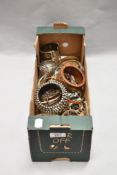 A box of contemporary bangles, to include a hardwood bangle, a metal studded bangle, and others
